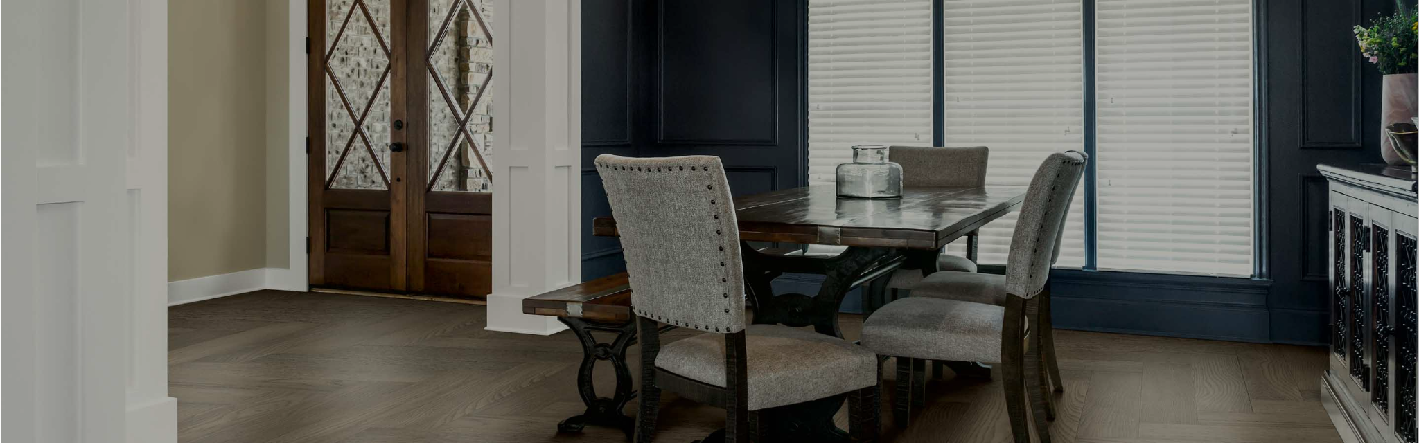 dining room with 3 large windows and blinds