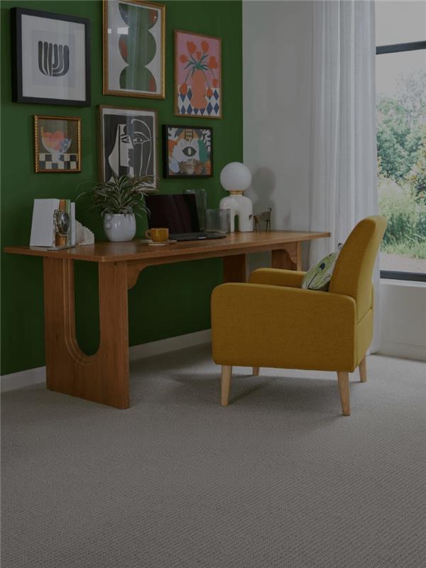 Woman sitting on a hardwood floor with a coffee mug in her hand.